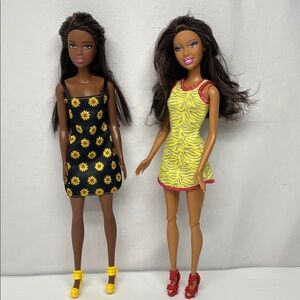 Barbie Dolls in Black Sunflower and Yellow Zebra Dresses
